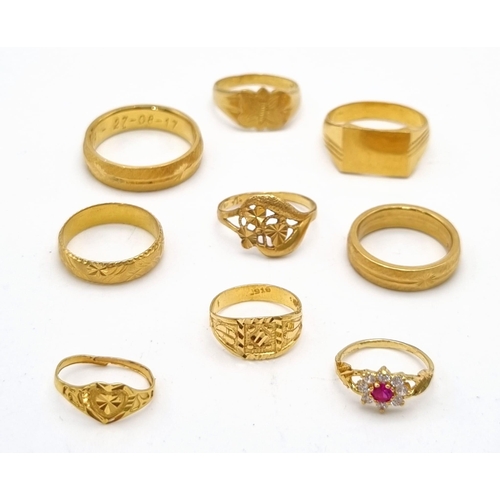 110 - A Mixed Gold Lot to Include: A 22K yellow gold selection of 10 bangles - 103.7g total weight - A/F. ... 