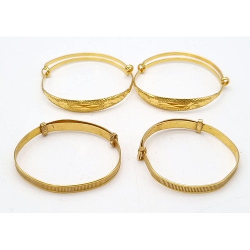 110 - A Mixed Gold Lot to Include: A 22K yellow gold selection of 10 bangles - 103.7g total weight - A/F. ... 