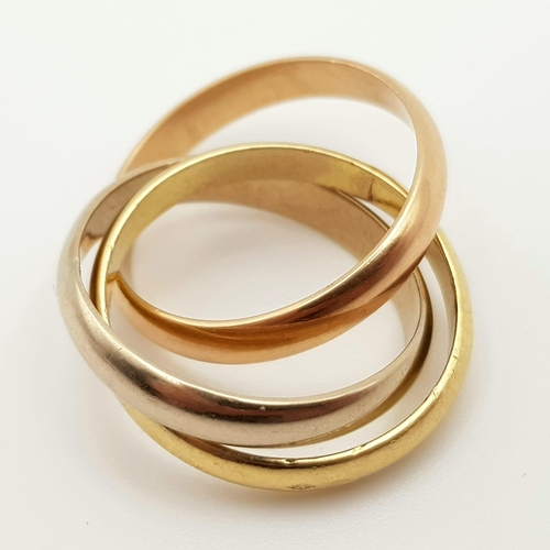 672 - An 18K Three Colour Gold Russian Wedding Ring. Size L. 8.67g. Ref: 4003