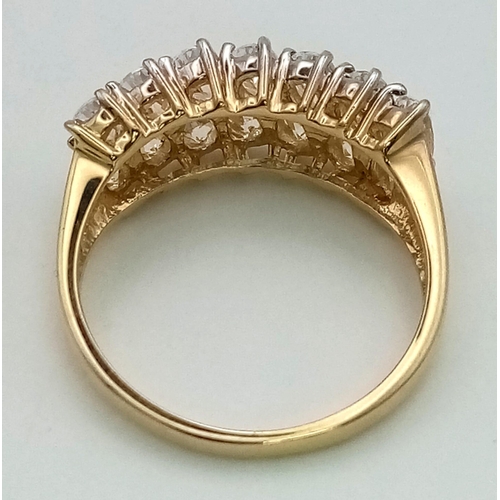 935 - A 14k gold ring set with diamond quality cubic zirconia. Size T. 5.7g total weight.