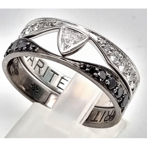 543 - A Sybarite 18k White and Black Gold Diamond Ring. Two bands with a heart-connector decorated with bl... 