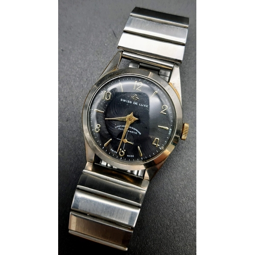 703 - A Rare Vintage Swiss de Luxe Watch. Stainless steel strap and case - 35mm. Black dial with sub secon... 