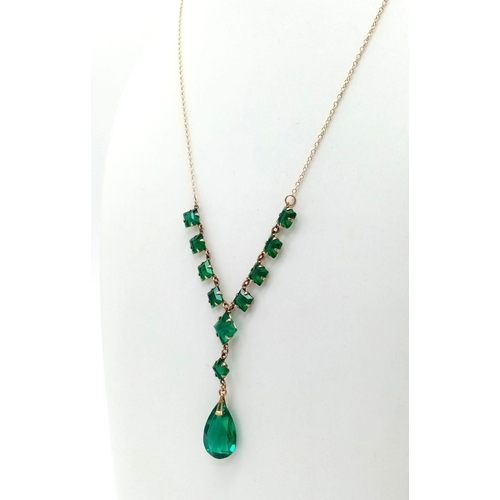 886 - An Art Deco Era Green Stone Ensemble on a 9K Yellow Gold Disappearing Necklace. 44cm. 4.75g total we... 