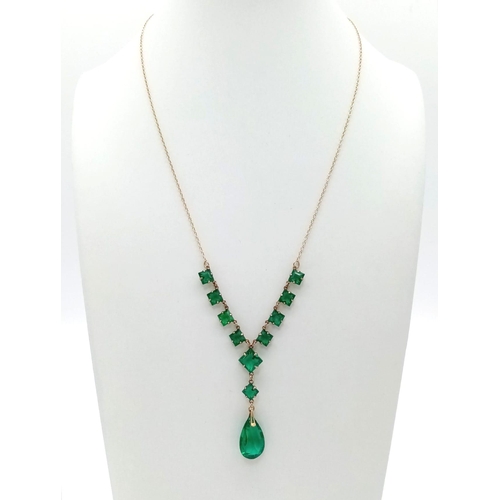 886 - An Art Deco Era Green Stone Ensemble on a 9K Yellow Gold Disappearing Necklace. 44cm. 4.75g total we... 