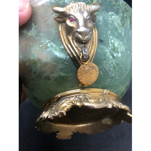 748 - STUNNING SOLID SILVER SPINACH JADE DIAMOND BOWL.

Stunning bowl with bulls heads either side hanging... 