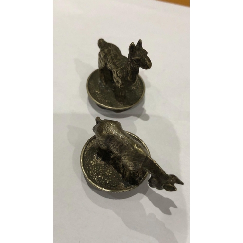 363 - A European antique white metal pair of novelty animal bottle stoppers.

Height of donkey 2.8cm
Lengt... 