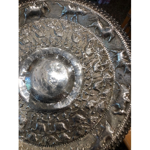 370 - A large white metal Burmese/Indian tray 
Diameter 30cm 
Weight 320.4 grams 