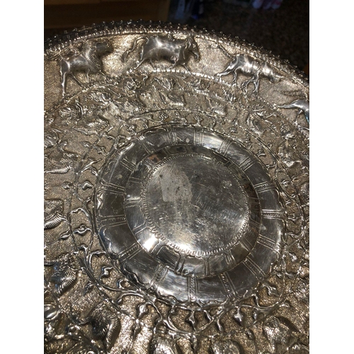 370 - A large white metal Burmese/Indian tray 
Diameter 30cm 
Weight 320.4 grams 