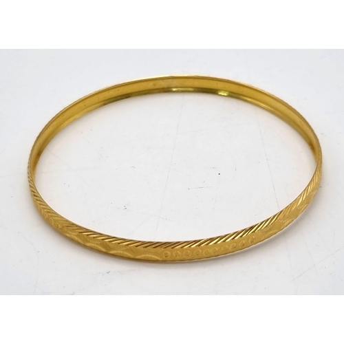 837 - A 21K Yellow Gold Slave Bangle - 6cm inner diameter - 8.53g and a Pair of 22K Gold Stud Earrings - 1... 