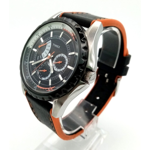 951 - A Timex Chronograph Gents Watch. Black and orange leather strap. Case -45mm. Black dial with three s... 