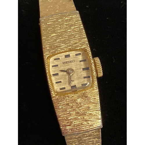 1013 - Ladies vintage SEIKO Gold plated wristwatch,Square face with textured bark surround. Manual winding ... 