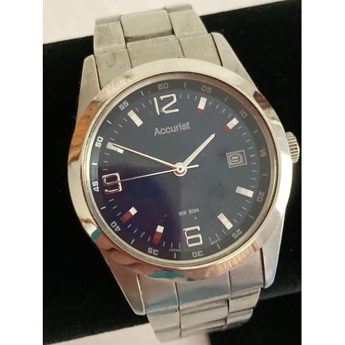 63 - Gentlemans ACCURIST Quartz Wristwatch in Silver tone, having midnight blue face with sweeping second... 