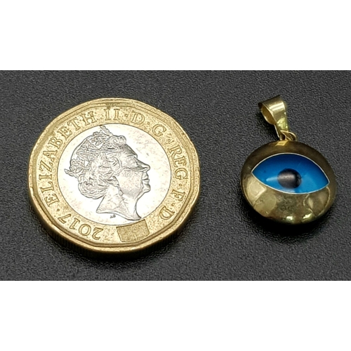 1052 - A 14k Gold Evil-Eye Pendant. 1.23g total weight. 2cm