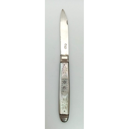 797 - A Georgian silver and mother of pearl folding fruit knife with integrated match striker. Carries Geo... 