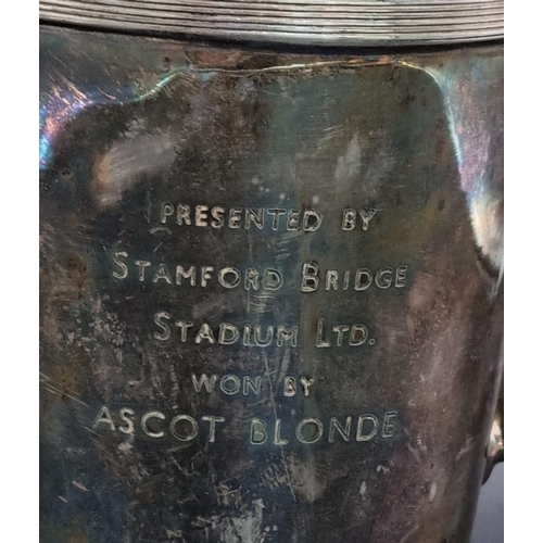 910 - Silver plated jug engraved, presented by Stamford Bridge Stadium Ltd. Won by Ascot Blonde.