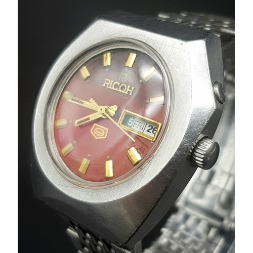 912 - A Vintage Ricoh 21 Jewel Automatic Gents Watch. Stainless steel strap and case - 36mm. Red dial with... 