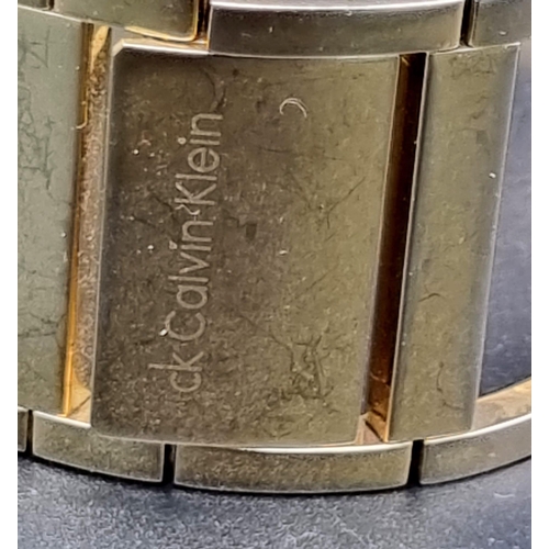 1003 - Calvin Klein CK gold tone bangle watch. Full working order, as found.