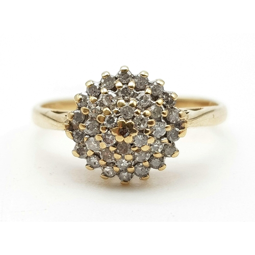 1068 - A 9k yellow gold diamond cluster ring. 0.25ct, 1.8g, size J.