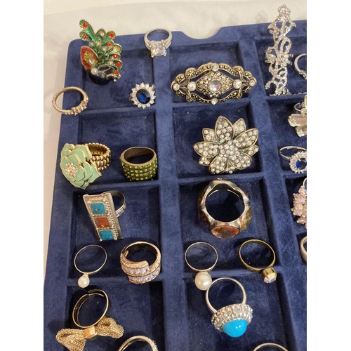 413 - Large interesting selection of dress rings to include Silver tone,gold tone, jewelled, enamel etc. P... 