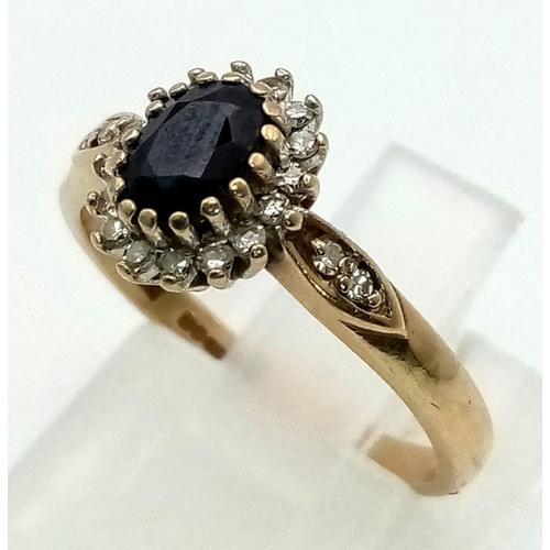 456 - 9k yellow gold diamond and sapphire cluster ring. 2.2g, size K.