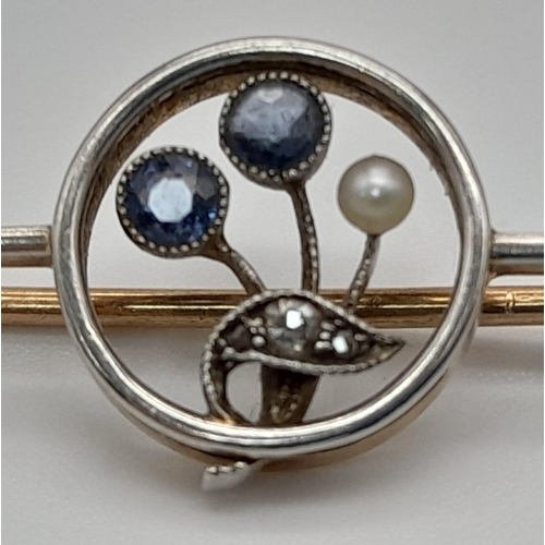 637 - 14k two tone vintage diamond and sapphire brooch. 3.6g in weight.