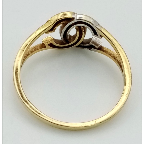 704 - 18k two colour CC designed ring. 208g, size Q.