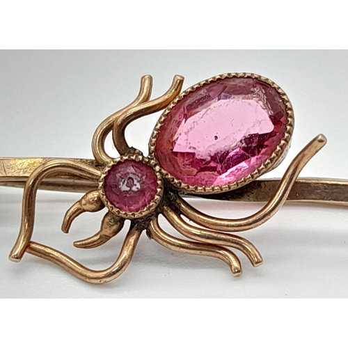 831 - 9k rose gold pink stone set spider brooch, 3g in weight.