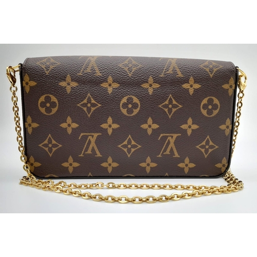 61 - A Louis Vuitton Monogrammed Pochette Felice Canvas Bag. Features two removable interior pockets. Can... 