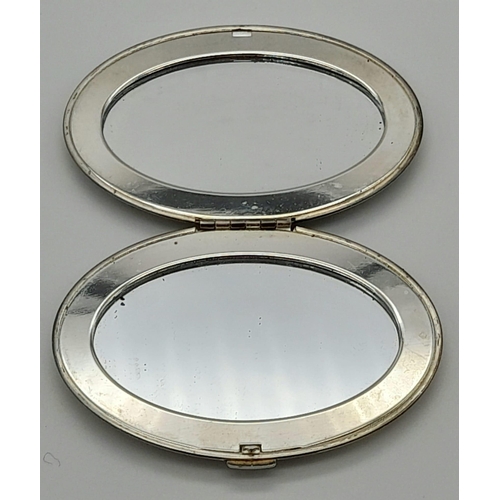 976 - A vintage GIVENCHY double folding beauty mirror with pouch. Dimensions: 81 x 58 x 13 mm,