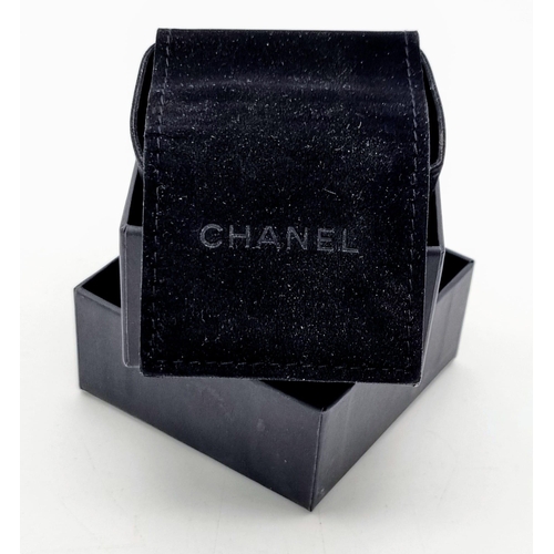 17 - A Pair of Chanel Monogram Pearl Earrings. Comes in a Chanel pouch with box. On white metal. 3cm drop... 