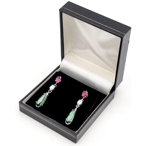 635 - A pair of drop earrings set with peridot, pink sapphire and diamonds all set in 18 carat white gold.... 