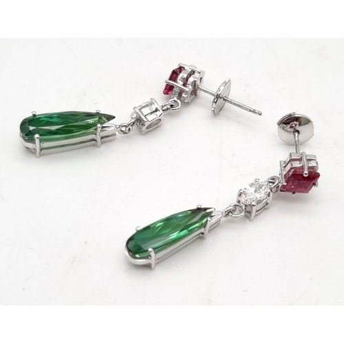 635 - A pair of drop earrings set with peridot, pink sapphire and diamonds all set in 18 carat white gold.... 