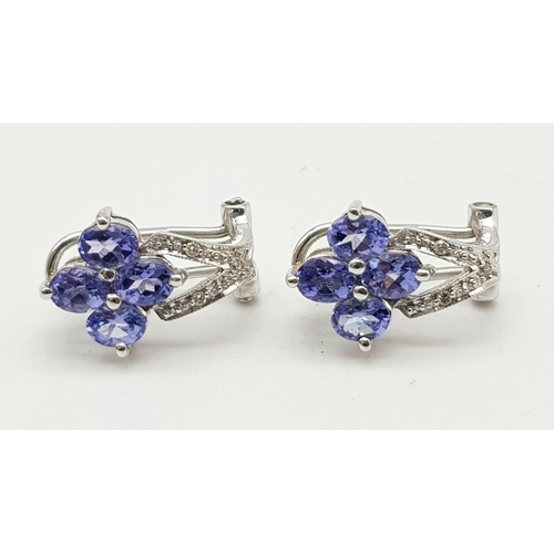 650 - 14k white gold diamond and iolite earrings. 3.5g in weight.