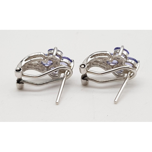 650 - 14k white gold diamond and iolite earrings. 3.5g in weight.