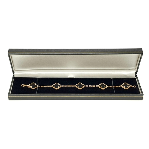 761 - A Van Cleef and Arpels Alhambra bracelet with 5 motifs - 18ct rose gold with black onyx inserts. Len... 