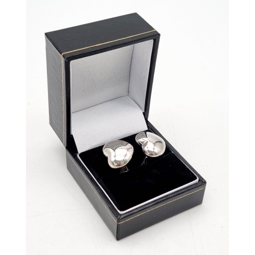 768 - A fabulous pair of Theo Fannell ‘art cufflinks made in18 carat white gold. These heart cufflinks are... 