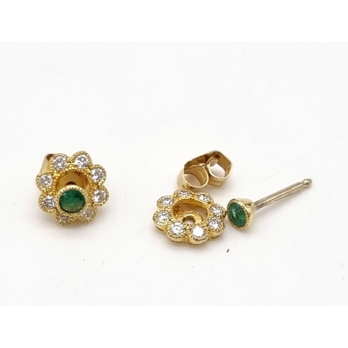 799 - 18K WHITE GOLD DIAMOND AND EMERALD CLUSTER STUD EARRINGS. CAN ALSO BE MADE INTO EMERALD STUDS.
WEIGH... 