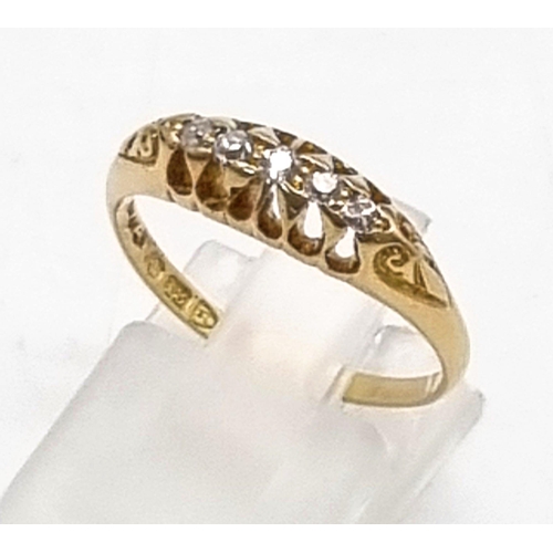 812 - AN 18K GOLD RING WITH 5 DIAMONDS IN CLASSIC STYLE.2.7gms  size O