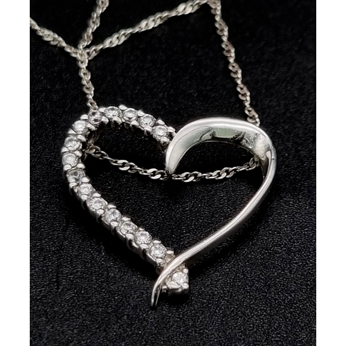 955 - Sterling silver heart pendant and chain. 2.4g in weight.