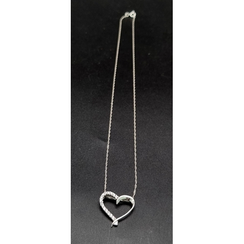 955 - Sterling silver heart pendant and chain. 2.4g in weight.