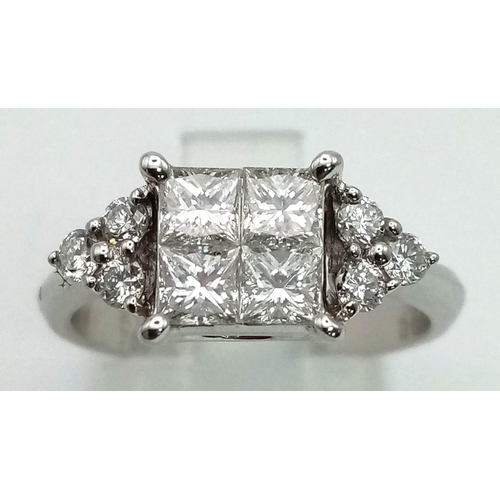 157 - An 18 K white gold ring, with quality diamonds (1.05 carats) on central cluster and shoulders. Ring ... 