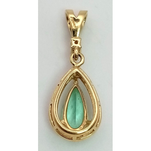 202 - 18k yellow gold diamond and green stone pendant. 2.7g in weight.