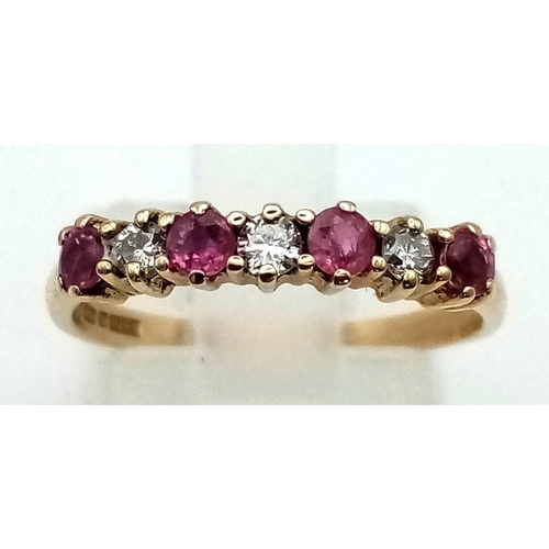 433 - 9k yellow gold diamond and ruby 7 stone ring. 1.5g, size L.