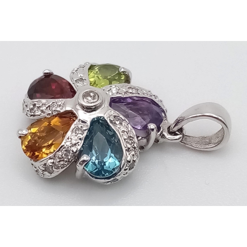 552 - A 9 K white gold, flower pendant with diamonds and peridot, garnet, citrine, aquamarine and amethyst... 