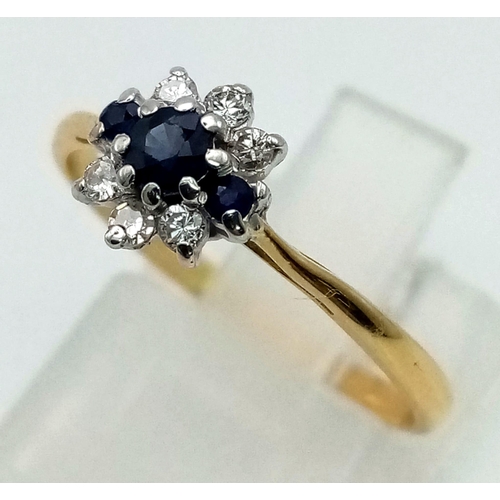 595 - 18k yellow gold diamond and sapphire cluster ring. 1.6g, size M 1/2.