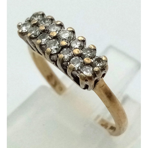 857 - 9k yellow gold diamond two row ring, hallmarked year 2000. 0.23ct, 2g, size K.