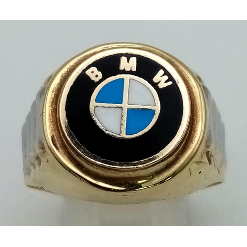 861 - A 14 K yellow gold ring with white gold highlights and the BMW logo on top. Ring size: Y, weight: 5.... 