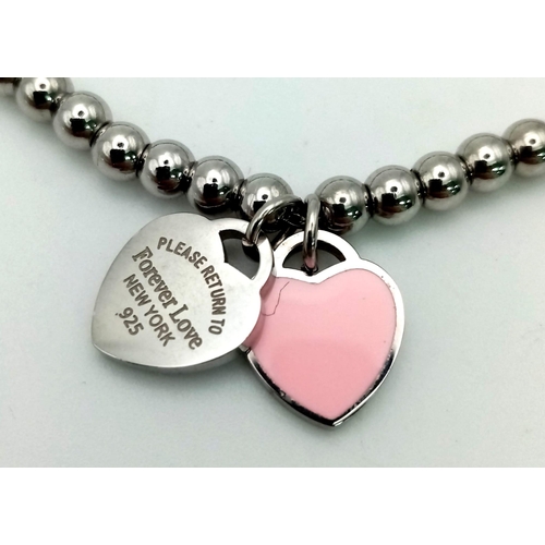 924 - White metal pink heart Forever Love bracelet. 11.3g in total.