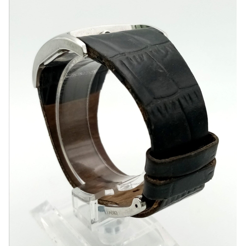 941 - DKNY black leather strap watch. As found.