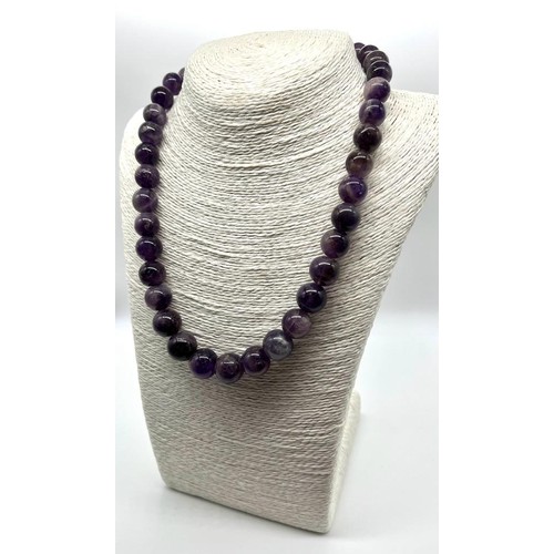 643 - A Deep Shades of Purple Amethyst Graduated Bead Necklace. 10-15mm.